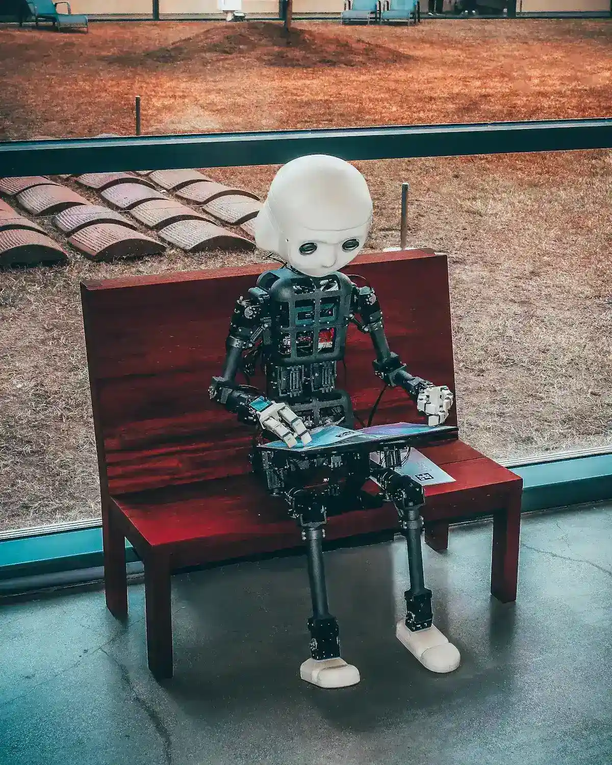 Robotic hand reaching toward a human hand — AI meeting marketing