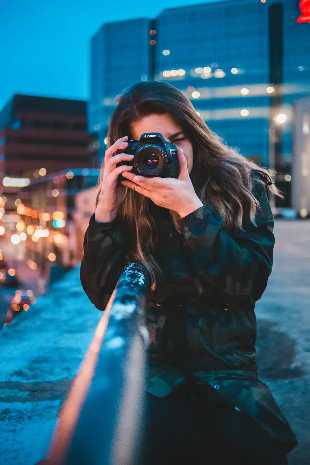 Photographer shooting content in the city at dusk