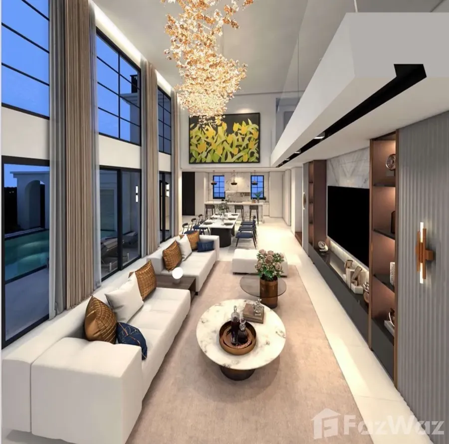 Double-height living room with chandelier — listing photo