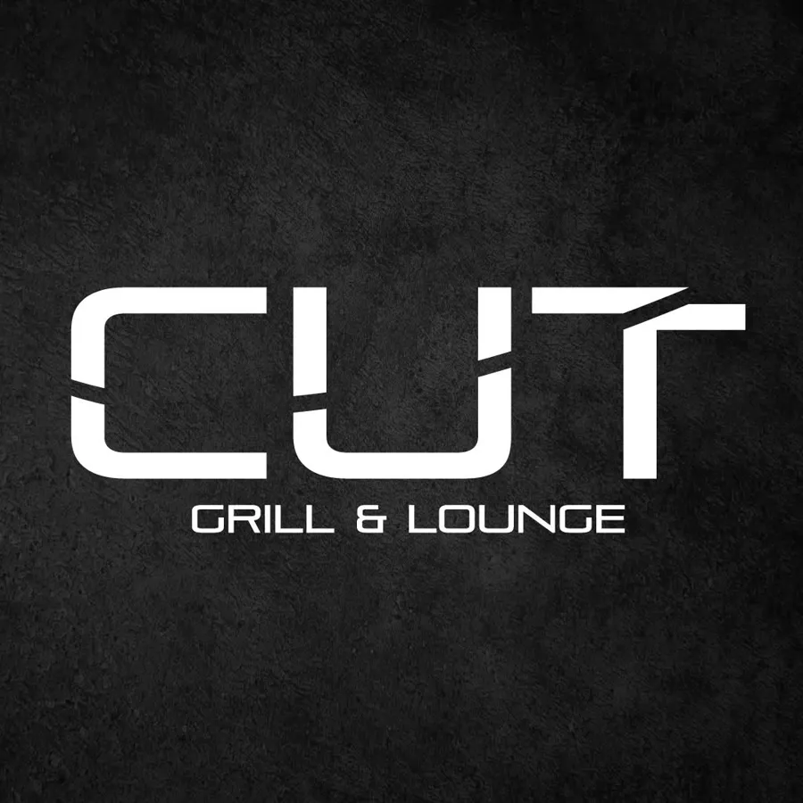 CUT Grill & Lounge white logo on black stone texture